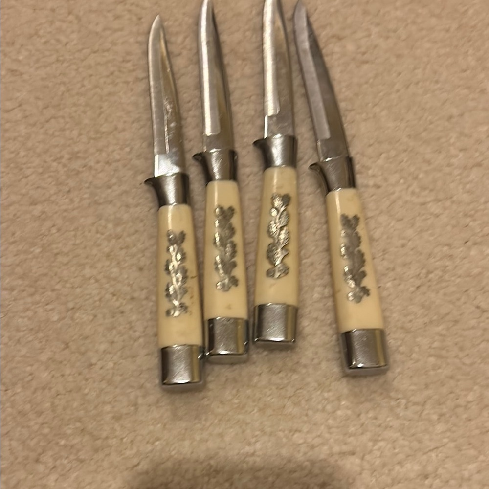 Vintage Silver and Cream Decorative Knives